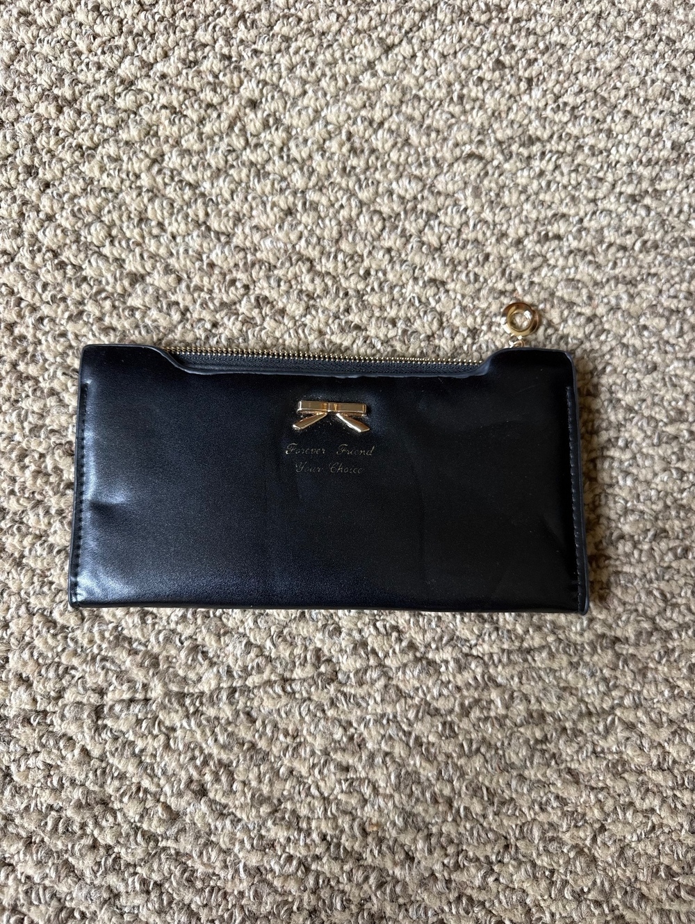 black card wallet with gold bow